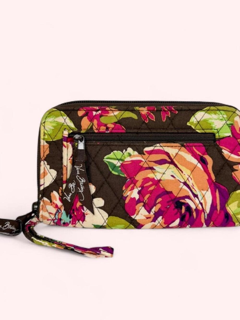 Vera Bradley floral zip around quilted wallet with wrist strap.